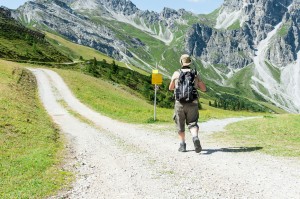 Hiker at Crossroads, exploring paths not taken, unlived life